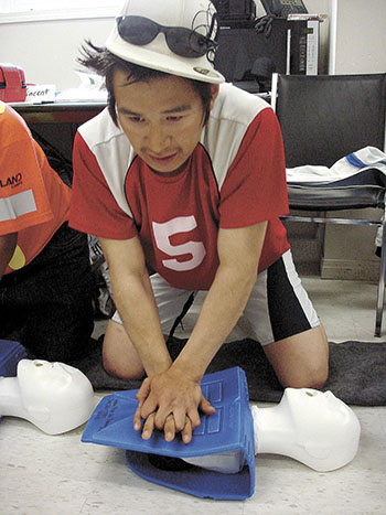 Vincent Ningeongan of Coral Harbour works hard to administer cardiopulmonary resuscitation during a first aid session during the Alliquujattiavait Kivalliq “Gems” program at the Meadowbank mine near Baker Lake.