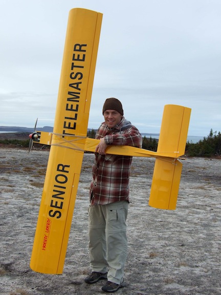 Pascal Poulin holds his Senior Telemaster, one of the larger models of remote-controlled airplanes.