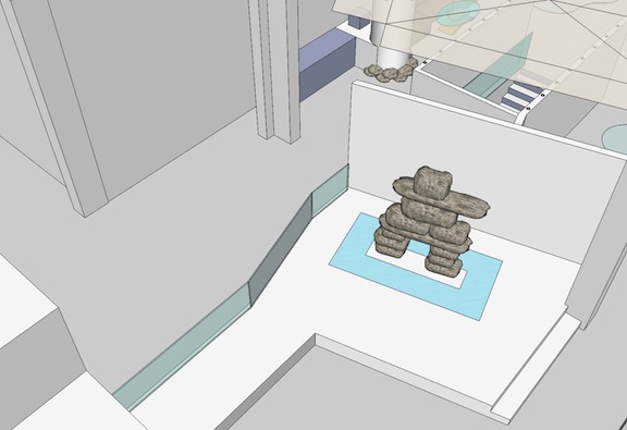 An inuksuk built by former Nunavut Commissioner Peter Irniq stands in the entranceway of the Northern House, a showcase for Nunavut, the Northwest Territories and Yukon during the 2010 Olympic and paralympic games. (COURTESY OF THE GN)