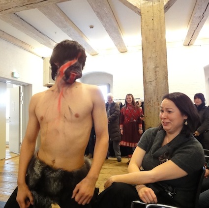 A bawdy East Greenlandic mask dancer flirts with a member of the audience during the Dec. 16 Inuit and Arctic Indigenous Peoples Day event at the North Atlantic House in Copenhagen. (PHOTO BY JANE GEORGE)
