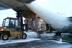 A forklift operator loads a pallet onto one of First Air's Lockheed Hercules 382 aircraft in an undated file photo taken at the Iqaluit airport. First Air is the only private operator in Canada that uses the huge Hercules transport planes.