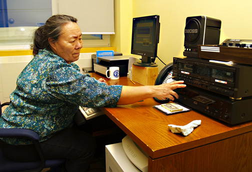 Leah Otak of the Igloolik Research Centre's oral history project digitizes one of the hundreds of taped interviews conducted with Igloolik elders as far back as 1986. The tapes contain a huge store of vanishing traditional knowledge and language.