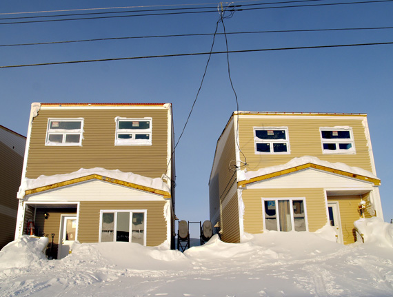 Two incomplete houses in Phase 2 of the Plateau Subdivision are covered in snow Feb. 9. Iqaluit city council voted this past Sunday to go ahead with Phase 3 this summer, at a cost of $5.7 million. (PHOTO BY CHRIS WINDEYER)