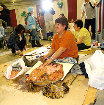 Women clean seal skins during the International Day of the Seal in Iqaluit in March, 2008. Nunavut agreed in principle this week to sign on to a declaration supporting ethical sealing. (PHOTO BY CHRIS WINDEYER)