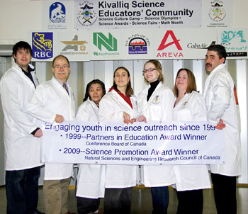 Kivalliq science teachers celebrate the NSERC award for science education at their regional science fair in Baker Lake. From left: Steve Penney (Whale Cove), Jim Kreuger (Baker Lake),  Angeline Simik (Chesterfield Inlet), Jeninith Peart (Baker Lake),  Jennifer Perry (Repulse Bay),  Katharine O'Connell (Rankin Inlet), Tony Phinney (Arviat). Missing from Photo: Bill Cooper (Baker Lake), Glen Brocklebank (Chesterfield Inlet), Danielle Fitzgerald (Arviat)