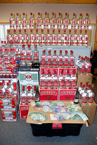 Nunavut RCMP seized all this booze earlier this month after doing searches on house 5004B and a taxi cab. (PHOTO COURTESY OF IQALUIT RCMP)