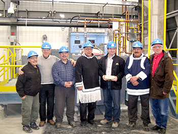 The Feb. 27 production of the first gold bar at Agnico-Eagle’s Meadowbank mine was cause for celebration. From left to right: Simon Tookoome, Baker Lake elder; James D. Nasso, chairman of Agnico-Eagle’s board; Peter Tapatai of Baker Lake, businessman; David Simailak, deputy mayor; Denis Gourde, general manager of Meadowbank (holding the gold bar); David Aksawnee, mayor of Baker Lake; and Ebe Scherkus, president and chief operating officer of Agnico-Eagle. (PHOTO COURTESY OF AGNICO-EAGLE)
