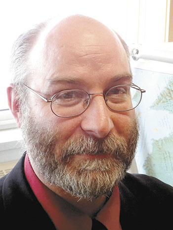 Whether it was for asking too many questions or for perhaps prolonging the last day of session, Ron Elliott, MLA for Quttituq, received gestures and comments urging him to speed up March 23 in the Nunavut legislature. (PHOTO BY JANE GEORGE)