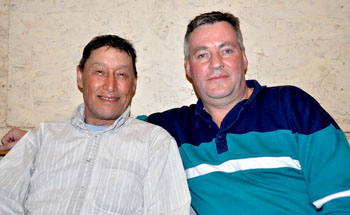 Colin Adjun of Kugluktuk, who is retiring after 30 years as a territorial wildlife officer, with Daniel Shewchuk, the GN’s environment minister, during a recent government tour of the Kitikmeot region. (PHOTO BY VANESSA MOSEK)