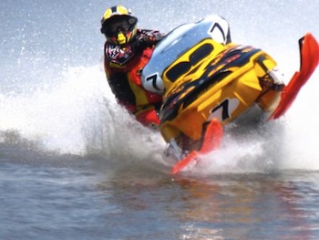 Snowmobile racing across water—  an activity also called 