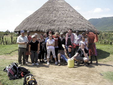 Juusi Aliqu, Yolande Amamatuak, Mattiusi Matt-Qiluqi, Sheila Nappatuk, Simon Anautak, Caroline Qumak and Susie Saviadjuk, chaperones, Juanasie Qaqutuk, Nellie Aliqu and elder Lucy Anautak, and teachers, Adam Feather and Quinn Carter from Akulivik, pose with their Kenyan guides and hosts in front of a boma, a traditional Kipsigi home. (PHOTO BY QUINN CARTER)