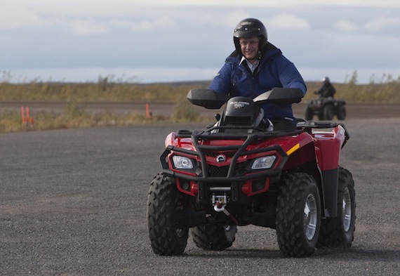 Prime Minister Stephen Harper hopped on an all-terrain vehicle in Tuktoyaktuk on Aug. 26, before heading off to Whitehorse. Earlier in the day, he had announced that Ottawa will aside an 1,800 square-kilometres area in the Mackenzie River Delta for belugas.