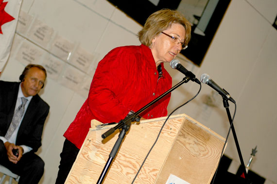 ITK president Mary Simon responding to the federal government's apology to the High Arctic Exiles in Inukjuak on Aug. 18. John Duncan, the new minister of Indian affairs and northern development, is seated behind her with his hands folded over an interpretation headset. (PHOTO COURTESY OF PATRICIA D'SOUZA, ITK)