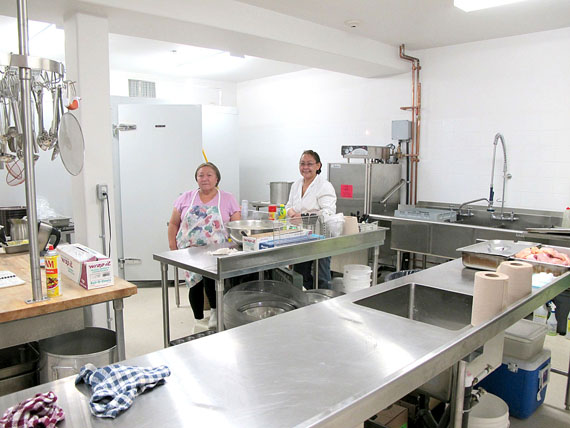 Kitchen workers Geesapee Kanayok, left, and Lena Totalik moved over from the old Tammaativik home into a kitchen twice the size. (PHOTO BY GABRIEL ZÁRATE)