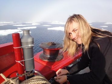 Researcher Anya Gawor attaches a cylinder to the deck of the Amundsen to take air samples which will show which pollutants have travelled to the Arctic from the south. (PHOTO BY JANE GEORGE)