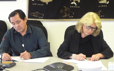 Pita Aatami, president of Makivik Corp., and Sylvie Godin, vice-president of Quebec’s human rights commission, Commission des droits de la personne et des droits de la jeunesse, prepare their notes for the Sept. 20 release of a report on youth and protection services in Nunavik. (PHOTO BY JANE GEORGE)