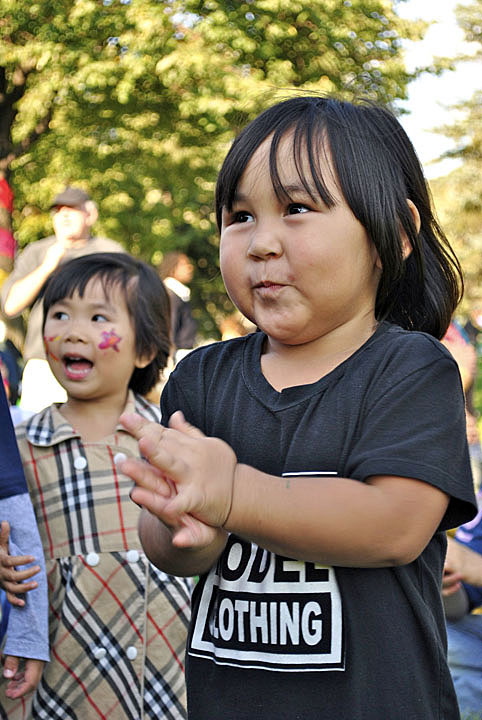Brooke Amaly Sivuarapik claps with delight as her mother, Alasie, throat-sings at a community event held Sept. 18 in the Villeray district in northeast Montreal. (PHOTO BY JIM BELL)