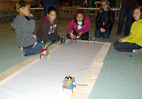 Students from Iqaluit's Aqsarniit Middle School race robots equipped with markers for legs at the Parish Hall Sept. 15. The event was a fundraiser for the Nunavut Food Bank. (PHOTO COURTESY OF KRISTEN KELLER)