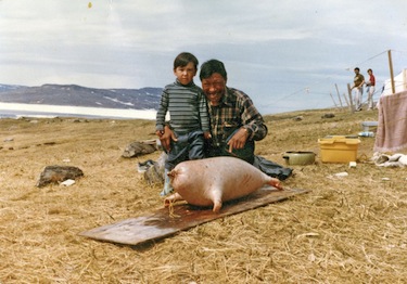 Isaacie Padlayat stands with his young son in this photo taken in Salluit in 1968. (PHOTO COURTESY OF AVATAQ)