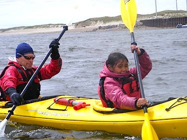 CanoeKayak Canada coach Peter Niedre and young Minnie Ittoshat navigate the Great Whale river by kayak together last June. (PHOTO BY ALLAN BROWN)