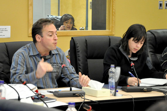 Hydro Quebec representatives Steve Fulham, left and Colette Lettre-Racine talk about renewable energy options the provincial agency is studying across Nunavik at a Kativik Regional Government council meeting Nov. 29 in Kuujjuaq. (PHOTO BY SARAH ROGERS)