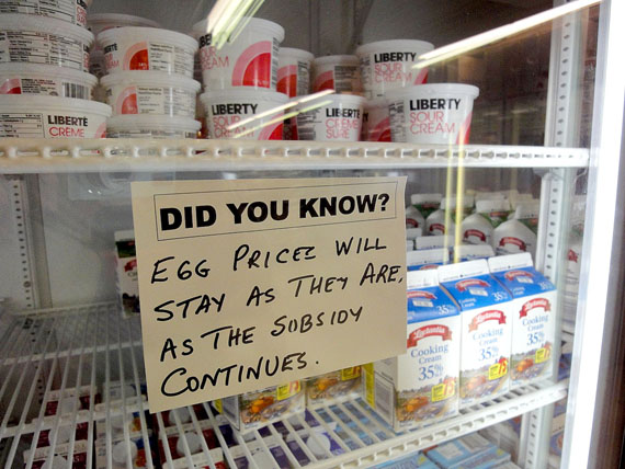 Eric Pearson, the owner of Newviq'vi Inc. in Kuujjuaq, is using signage to educate customers about the effect of changing food subsidies. This sign says that the price of eggs will stay the same. (PHOTO BY JANE GEORGE)