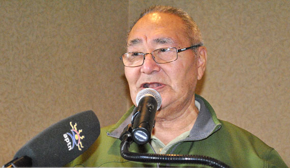 Elijah Erkloo of Pond Inlet, chair of the Inuit Uqausinginnik Taiguusiliuqtiit language authority, speaking shortly after the opening of the Inuit language standardization symposium Feb. 8 at Iqaluit's Frobisher Inn. Delegates from Nunavut, Nunavik, Nunatsiavut, Greenland and the Inuvialuit region of the Northwest Territories were to have broken into workshops to discuss various topics related to the current status of the Inuit language. On the afternoon of Feb. 10, organizers are to hold a workshop at the Astro Theatre on the future direction of language standardization. The week-long meeting is scheduled to wrap up late Friday morning. (PHOTO BY JIM BELL)