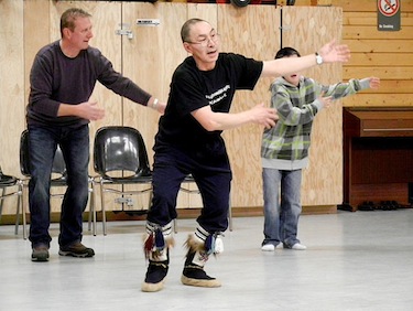 Young, old, Inuit and non-Inuit are welcome to participate in the weekly practice session of Innuinait drummers and dancers, led by Jerry Puglik [front], who teaches the group along with his partner, Julia Ogina. (PHOTO BY JANE GEORGE)