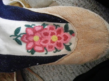 The design on this kamik from the Western Arctic includes flowers made using French knots. (PHOTO BY JANE GEORGE)