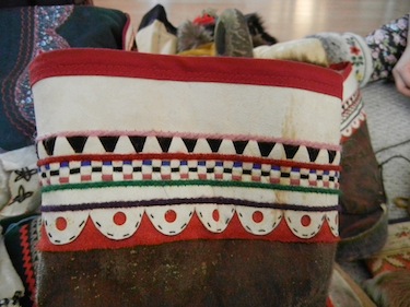 The colourful leather detail on this kamik is similar to that seen at two ends of the Inuit world— in Chukotka and Greenland. The colourful detail is a combination of sealskin leather bleached and dried when the sun first returns, with colourful threads of yarn, Inserted between finely sliced slits. (PHOTO BY JANE GEORGE)