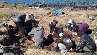 Students help excavate the site of a semi-subterranean house at Qarmait nearby the community of Kangiqsujuaq last summer. Qarmait is one of two sites that the local landholding corporation wants to develop as a tourist attraction. (PHOTO/AVATAQ)