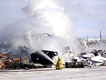 Since the Kuujjuaq branch of the Canadian Imperial Bank of Commerce burned down March 6, as shown here by a photo taker about 10:30 a.m. that morning, the bank management has been scrambling to find alternative ways for their clients to keep using their services. (SUBMITTED PHOTO)