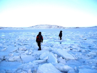 Atsiaq Alasuaq and Pootoogoo Elee on a sijja in Cape Dorset, ice that has formed around the edge of land. The local elders contributed their knowledge to the siku atlas, and extensive online site documenting Inuit knowledge of sea ice in the Canadian Arctic. (PHOTO BY GITA LAIDLER)