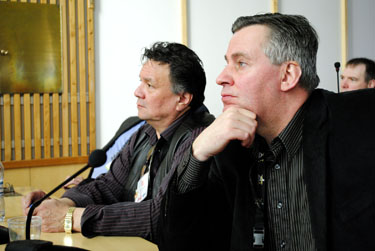 Dan Shewchuk, Nunavut's environment minister, and Peter Taptuna, the economic development minister, listen to a lecture on Finland's new mining law. (PHOTO BY JIM BELL)