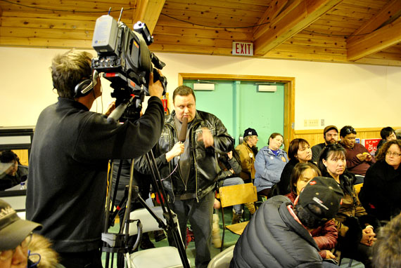 Hal Timar of the Baffin Regional Chamber of Commerce asks a question about the Government of Nunavut's borrowing limit at the all-candidates forum held April 23 in Iqaluit. Nunavut's four federal candidates now have less than week of campaigning time left before the May 2 election. (PHOTO BY JIM BELL)