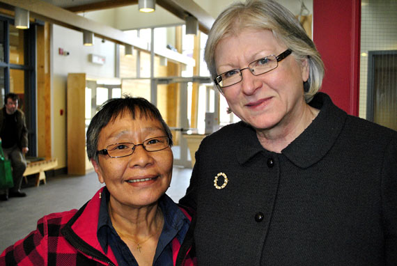 Sheila Fraser in Iqaluit with legislative interpreter Mary Nashook, who's just one of the many Nunavummiut whose lives Fraser touched during her 10-year
stint as Auditor General of Canada. Fraser, whose term expires May 31, appeared before the Nunavut legislative assembly's standing committee on operations April 14 to discuss her report on services for children and youth in the territory. She also announced that she has signed off on the Nunavut Business Credit
Corp.'s latest financial statements, and did not issue a denial of opinion. (PHOTO BY JIM BELL)