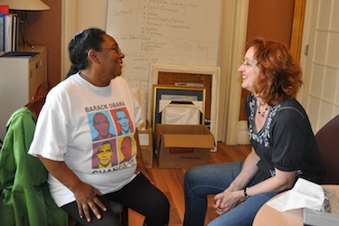 Outreach worker Annie Pisuktie, left, chats with Sylvie Cornez, the director at the Montreal day shelter Chez Doris. The needs of women in the Inuit community are “overwhelming,” Cornez said. But since Pisuktie has been hired, “we’re seeing a difference.” (PHOTO BY SARAH ROGERS)