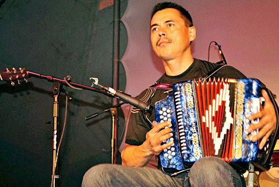 Stephen Innuksuk and band playing at a Canada Day square dance organized inside the Alianait tent on Canada Day in Iqaluit. (PHOTO BY JIM BELL)