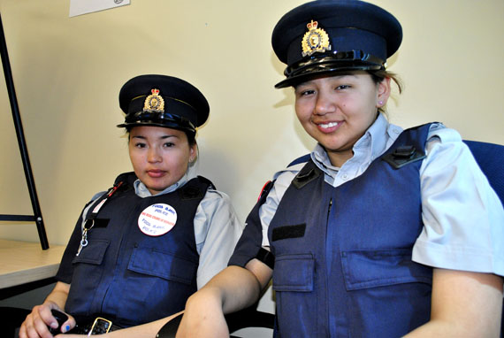 Natasha Ottokie of Coral Harbour and Marilyn Sandy of Rankin Inlet are among 14 students from around Nunavut who landed jobs with RCMP V Division in Iqaluit this summer. On June 17, they graduated from a one-week preparatory course and will spend the next eight weeks working with regular RCMP officers on low-risk, non-emergency situations, learning skills like note-taking, introductory law and drug awareness. (PHOTO BY JIM BELL)