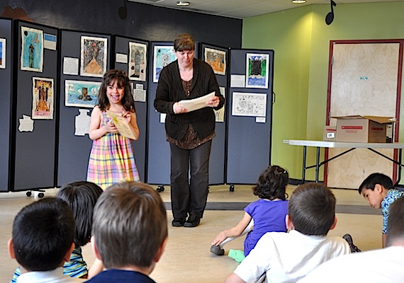 Staff at Trois-Soleils school in Iqaluit hand out certificates of achievement to this beaming student and her classmates June 23. Parents joined in the ceremony followed by lunch to celebrate the end of the year at Iqaluit's French-language school. (PHOTO BY SARAH ROGERS)