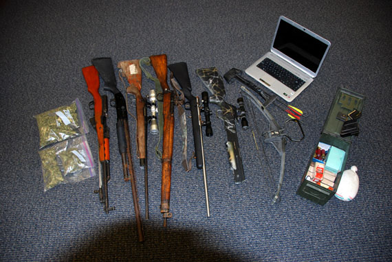 This RCMP photo shows some of the weapons and pre-packaged marijuana seized by police July 22 at house 2657 in Iqaluit.  (PHOTO COURTESY OF THE RCMP)