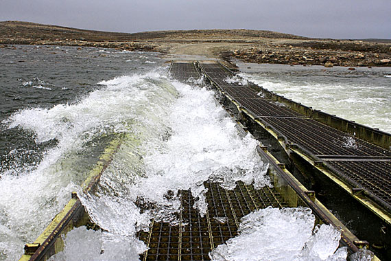 This bridge near Cambridge Bay, which leads to the old town site, is a victim of some of the worst run-off seen in the community for at least 30 years. Another bridge that connects Cambridge Bay to the nearby territorial park was also damaged by erosion two weeks ago. After closing for a week, it has since reopened. (PHOTO BY DERRICK ANDERSSON RED SUN PRODUCTIONS)