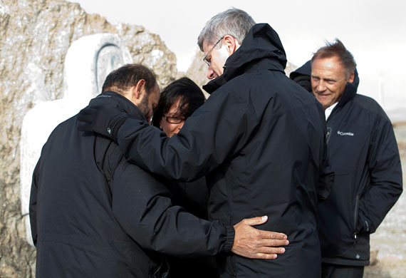 Prime Minister Stephen Harper on Aug. 23 in Resolute Bay consoles Aziz Kheraj, owner of the South Camp Inn, who lost his grandaughter Cheyenne Eckalook and several staff members in the Aug. 20 crash of First Air flight 6560. (PHOTO BY DEB RANSOM, PMO)