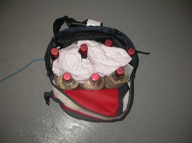When police opened the backpack shown in the photo above, they found bottles of vodka, neatly packed for shipment. (PHOTO/ RCMP)
