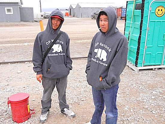 Benjamin Niptayuk of Kugaaruk and Keith Poodlat of Gjoa Haven take a smoke outside at the Operation Nanook camp near Resolute's airport. The two are among the more the hundreds of Canadian Rangers and members of the Canadian Armed Forces in and around Resolute for the annual summer sovereignty and summer training exercises. (PHOTO BY JANE GEORGE)