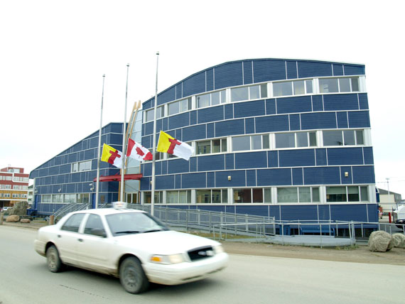 Flags at Nunavut’s legislative assembly fly at half-mast Aug. 22  to recognize the 12 who died Aug. 20 in the crash of First Air 6560 in Resolute Bay.The flags will remain at half-mast until Friday, Aug. 26 at sunset. (PHOTO BY CHRIS WINDEYER)

