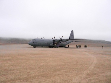 Here a Canadian Forces Hercules stands on the runway of the Resolute Bay airport Aug.18, against a wall of fog. (PHOTO BY JANE GEORGE)