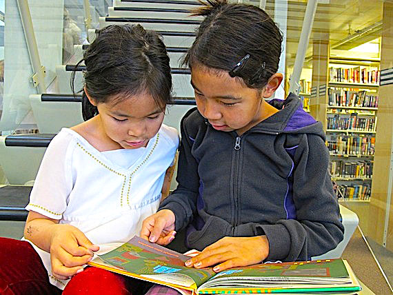 During Literacy Week in Nunavut, Sept. 25 to Oct. 1, the May Hakongak library in Cambridge Bay is hosting events to encourage young — like these two girls, Jewel (left) and Tiana (right) Maksagak — and old to read. On Sept. 28, the Nunavut Literacy Council is encouraging people to read for at least 15 minutes. Nunavut wants to challenge the Northwest Territories, which won the territorial
