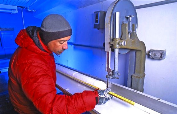 Glaciology research scientist Christian Dzanowicz, from the Geological Survey of Canada, is shown cutting samples from the Mount Logan ice core in the cold room lab in Ottawa. (HANDOUT PHOTO BY DAVID BARBOUR)