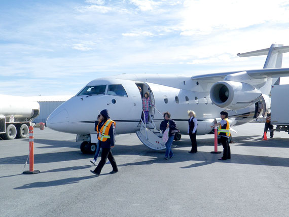 Passengers in Rankin Inlet disembark from Calm Air’s new 32-seat Dornier 328 jet aircraft Sept. 1 after its inaugural flight from Winnipeg, which took only two hour and two minutes. It’s now in use five days a week, from Monday to Friday, offering hot meals, a lavatory, in-flight DVD players and shorter Winnipeg-Rankin flight times. (PHOTO COURTESY OF CALM AIR)
